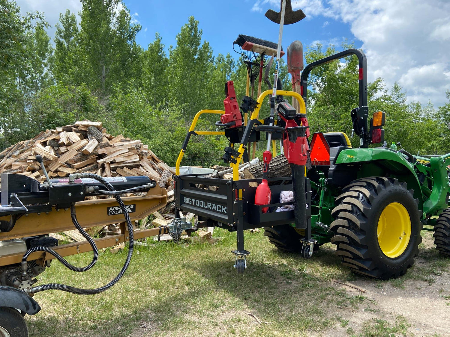 john deere compact tractor with the big tool rack ultimate rack carry all - towing log splitter, tools on tractor carry all as well as fitting all his split timber - avilable from 626 group Australia - hobby farm tractor accessories