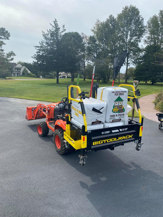 kubota compact tractor with big tool rack carry all - carrying tools and equipment on acreage property