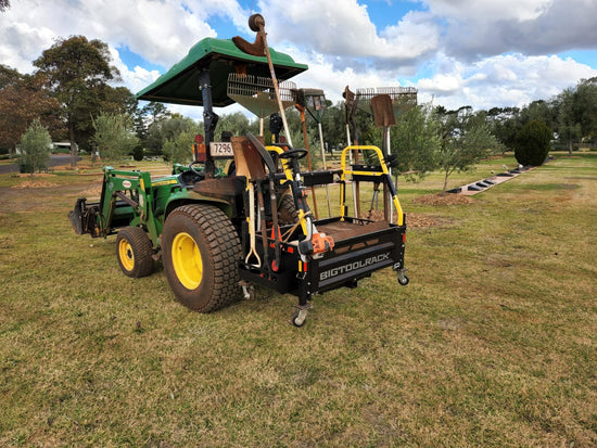 john deere 3038E with big tool rack ultimate rack working in cemetery on grounds keepers tractor 