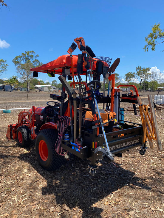 Kubota compact tractor with loader carrying the ultimate rack carry all carry all in orange - carry all your tools, jerry cans, and tractor accessories 