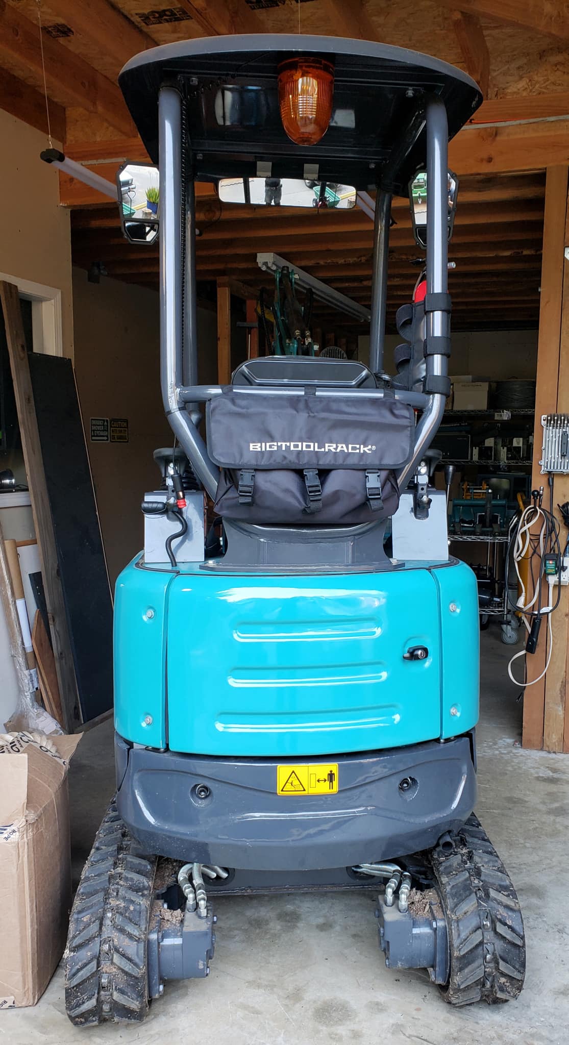 Rops Rack Gear bag on Kobelco Excavator storage unit