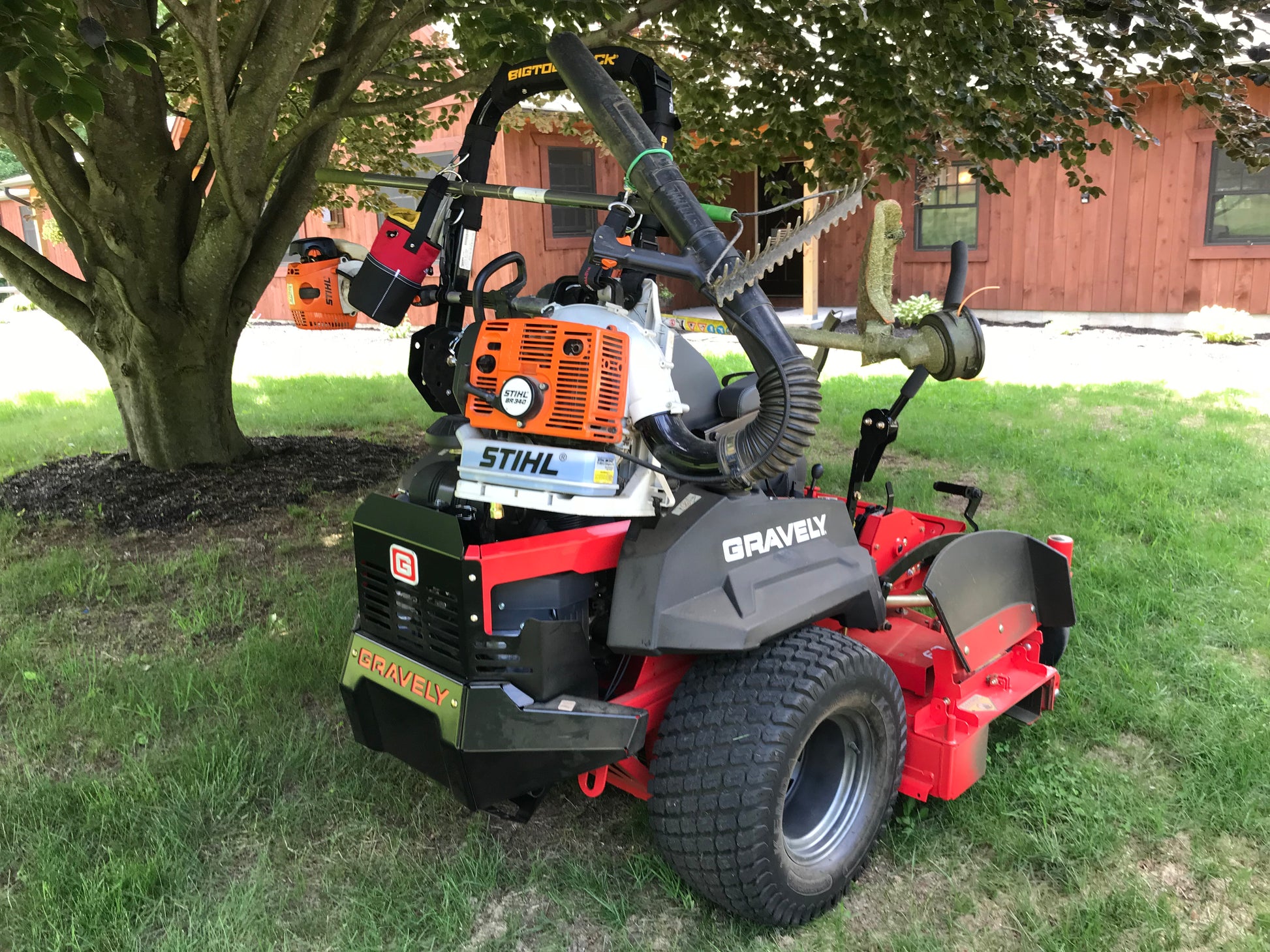 Australia big tool rack on Gravely mower with hedge trimmer leaf blower whipper snipper carrying tools on farm